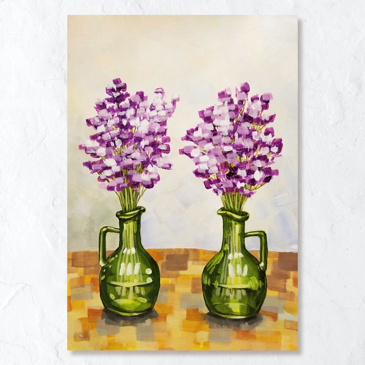 Purple flowers in green vase